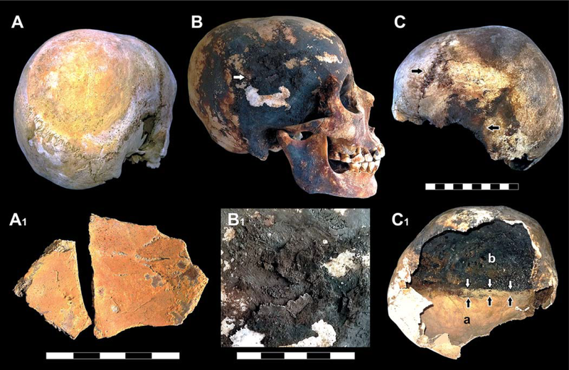 Red and black mineral residues were found outside and inside the victim’s skulls.